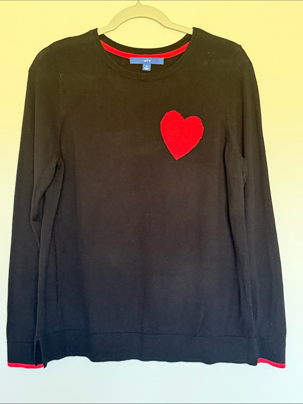 Black Sweater with Red Heart Detail